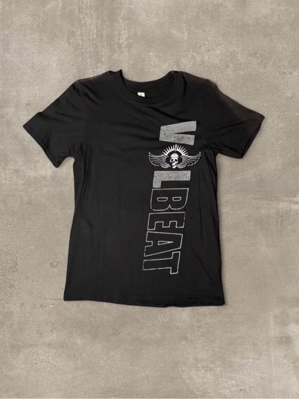 Black Volbeat band tee with white 'volbeat' text and skull graphic